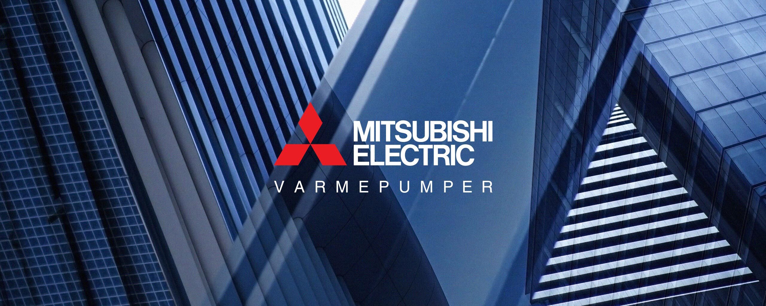 Utsnitt av bygningsmasse og Mitsubishi Electric logo.